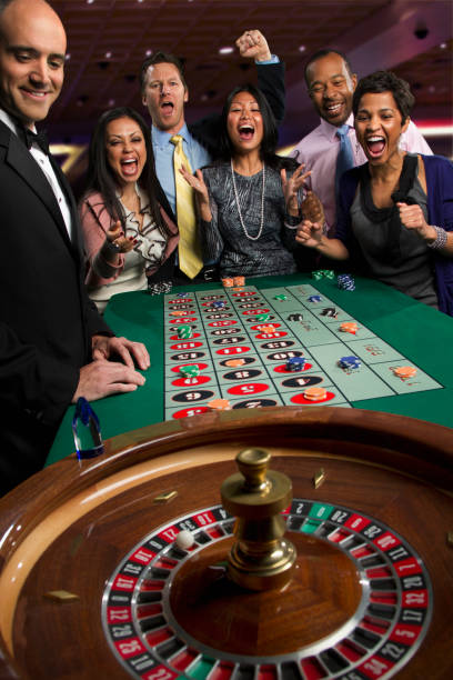 Close-up of Evolution Gaming table with dealer, chips, and live broadcast setup